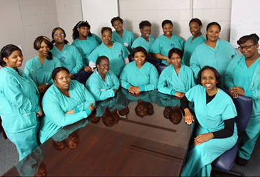 A 2013 photo of the first cohort of interns from the Support Services Internship Program. The program’s 20th cohort will graduate in May, 2022.